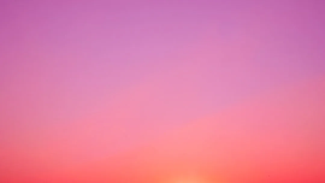 the sun is setting over the horizon of a beach