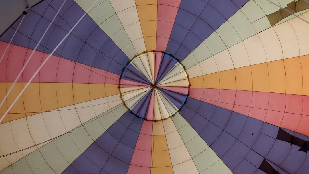 low angle photography of parabolic umbrella