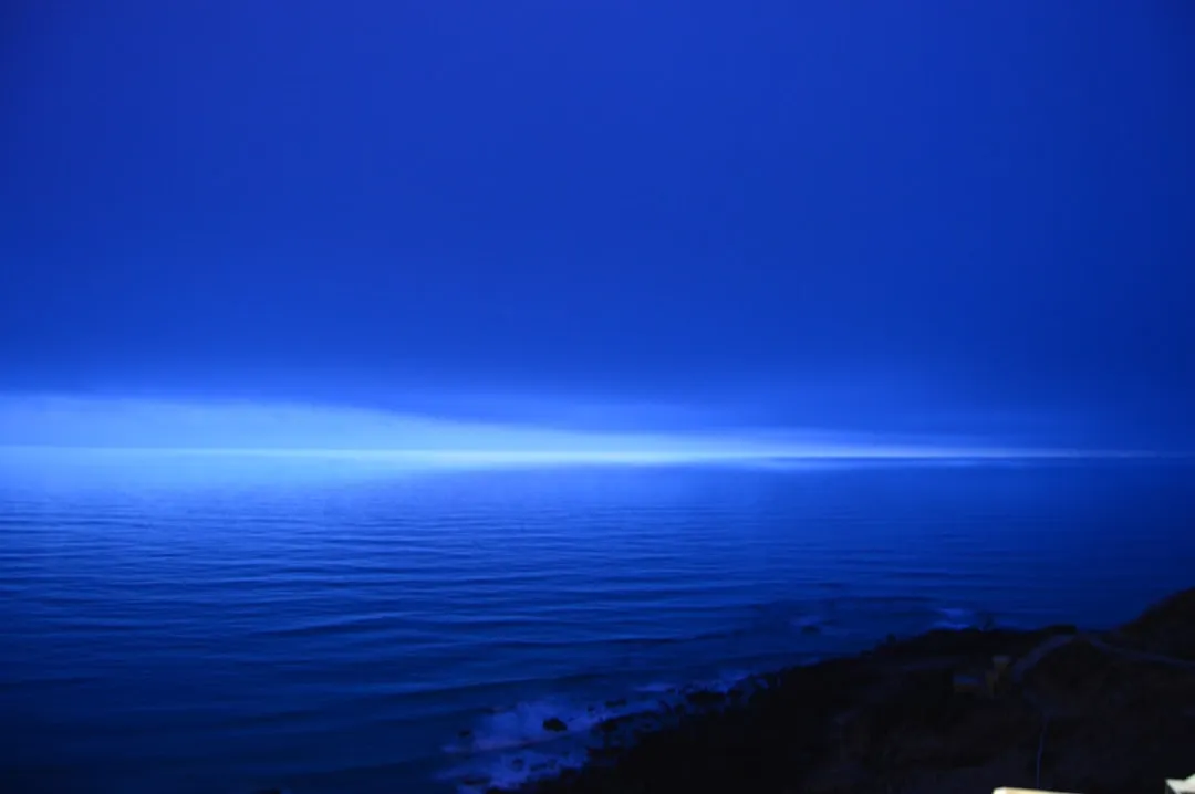 A view of a body of water from a hill