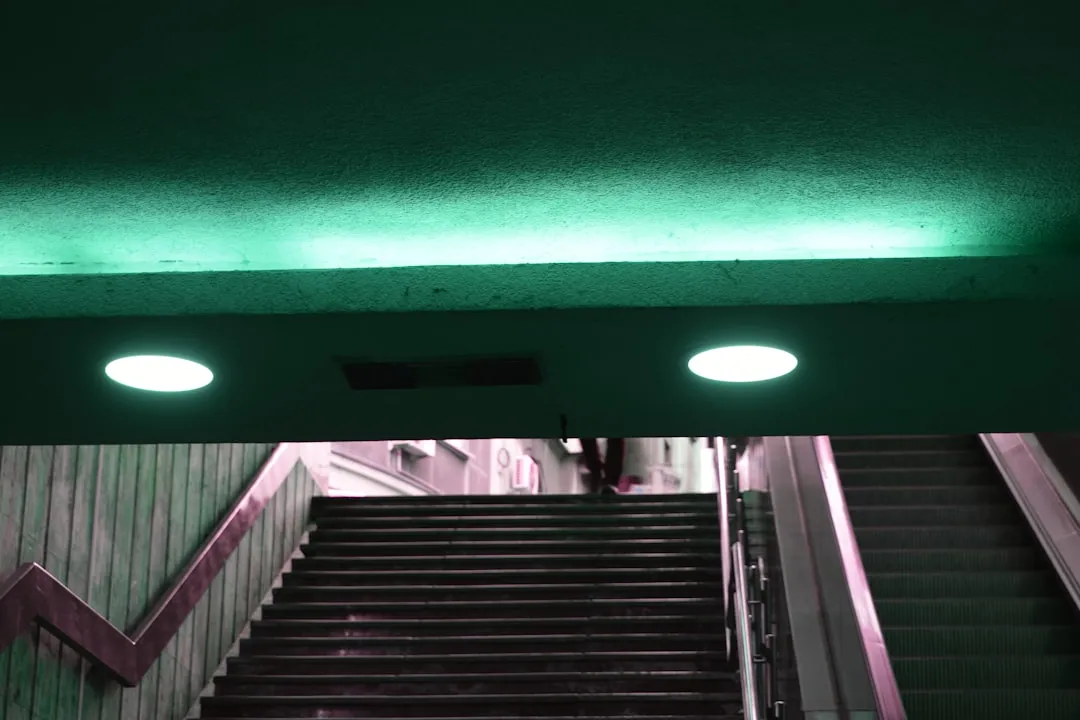 An escalator with a green light above it