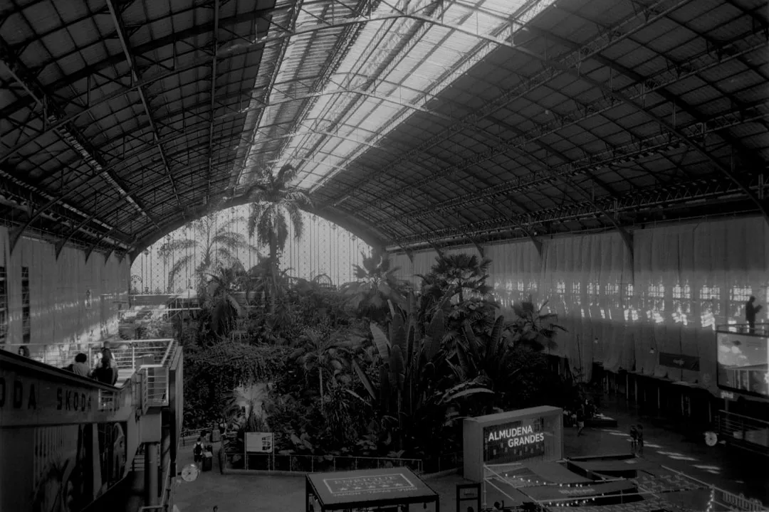 a black and white photo of a train station