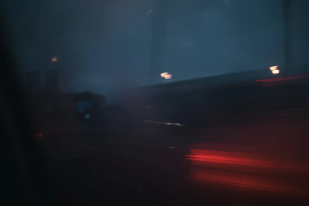 Blurred lights on a dark road at night