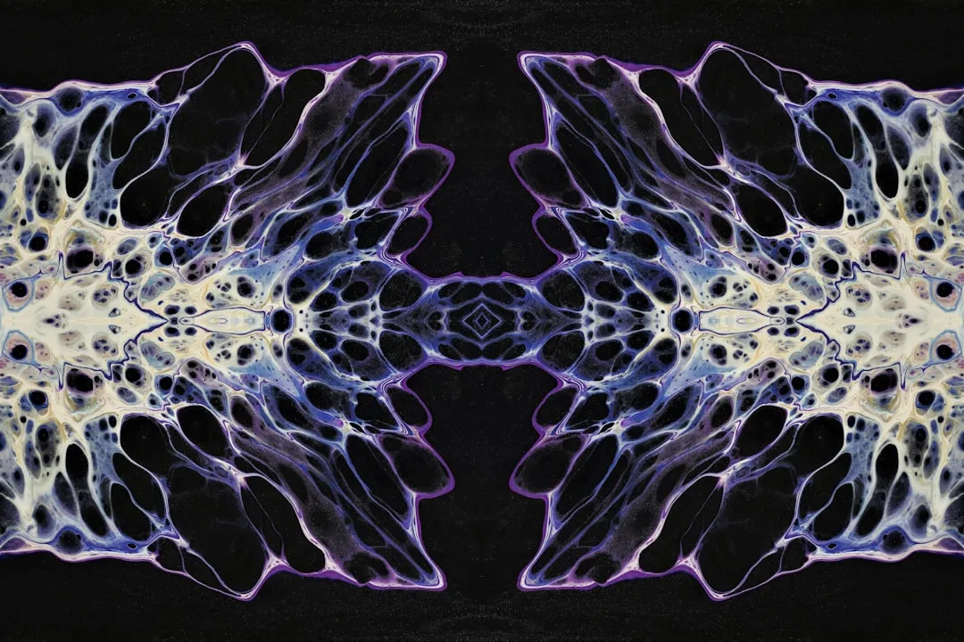 a close up of a purple and white sea creature