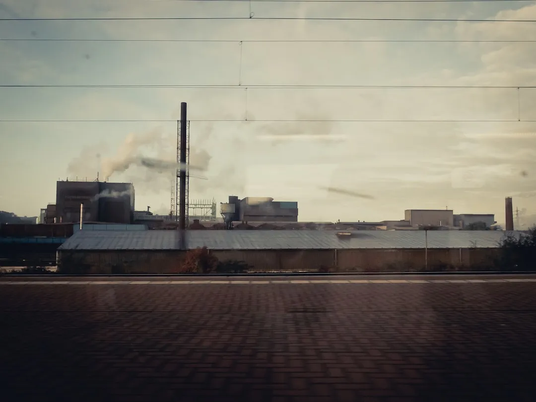 a factory with smoke coming out of it's stacks