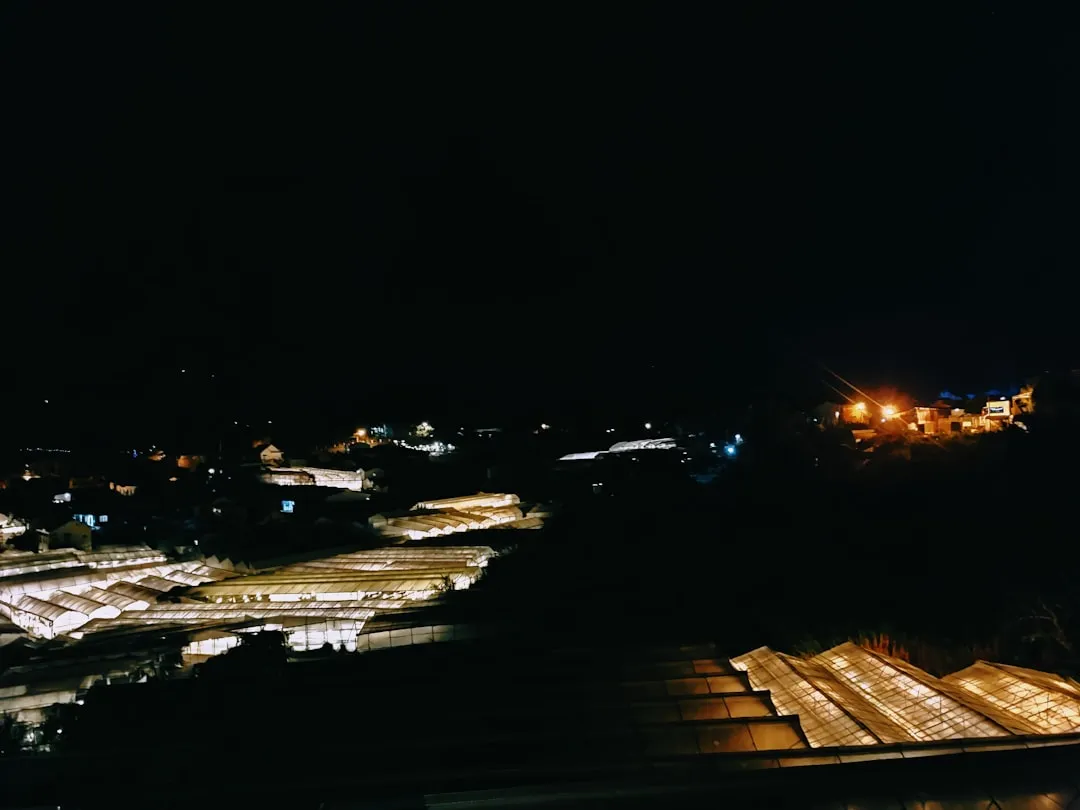 a view of a city at night from the top of a building