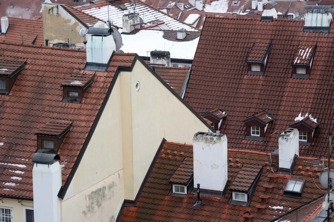 Rooftops of old european buildings with dormer windows.