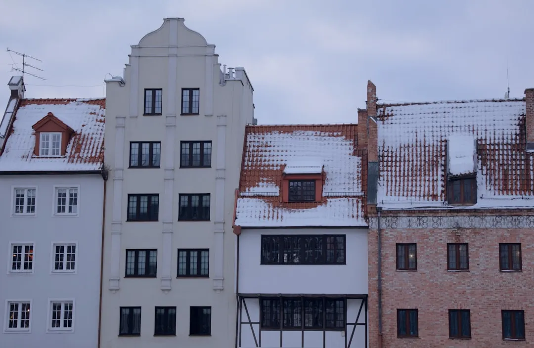 Row of historic buildings with snow on roofs