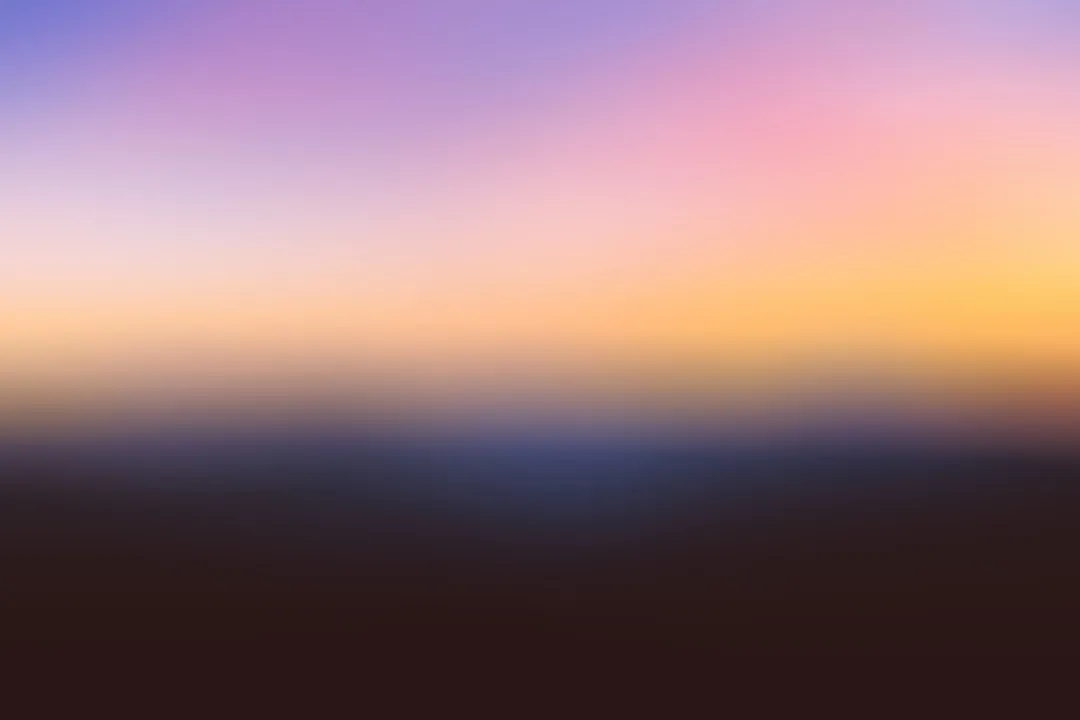 a sunset over a large body of water