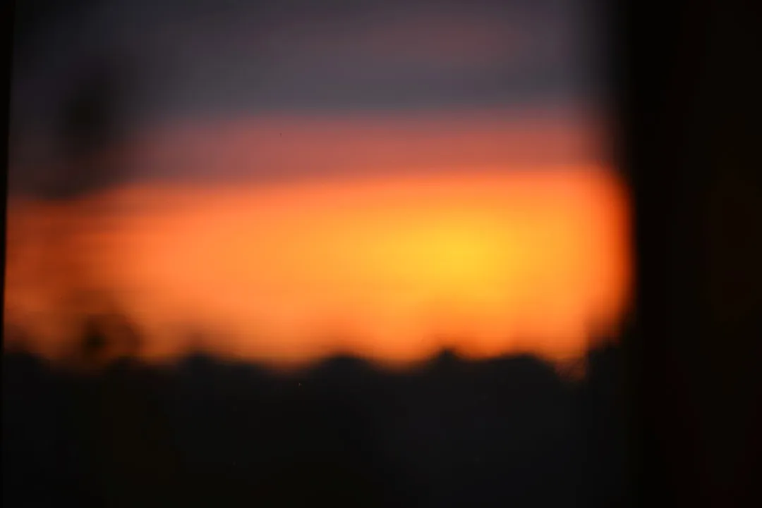 Blurred sunset over a dark horizon