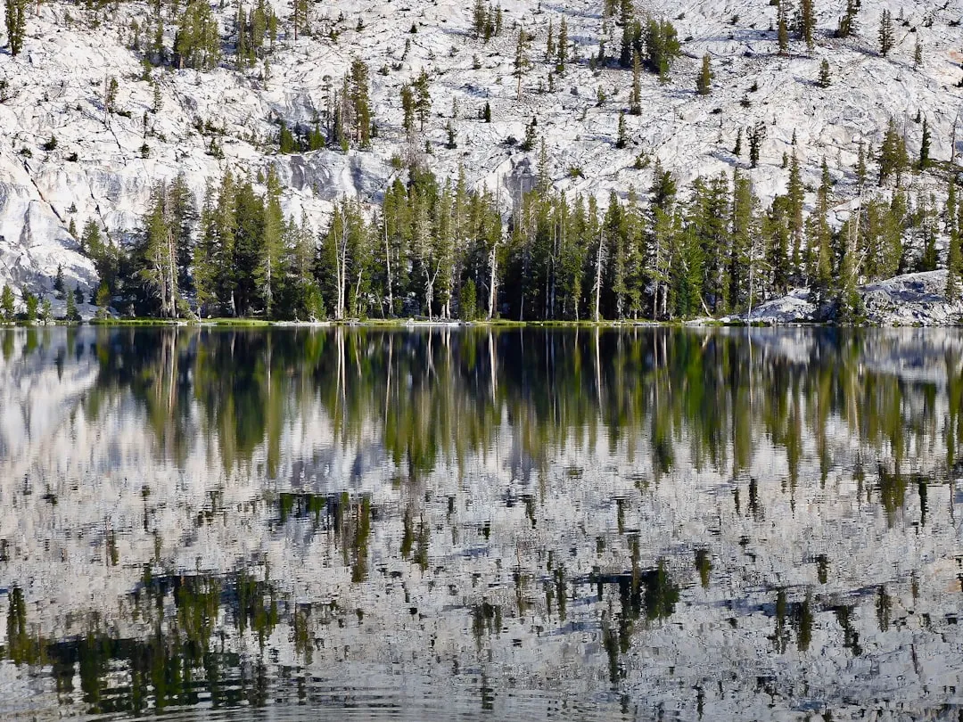 a mountain lake surrounded by trees and rocks