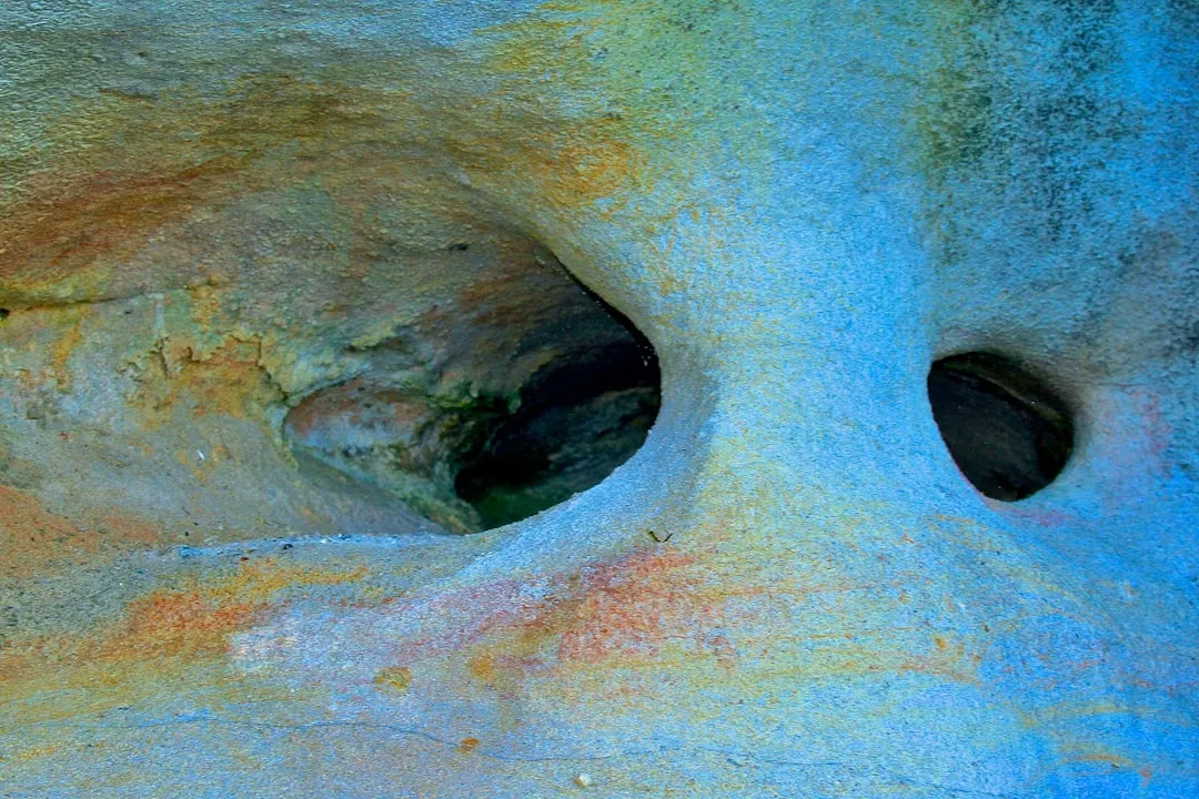 Abstract rock formation with colorful mineral deposits