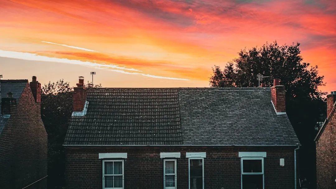 a house with a red sky in the background