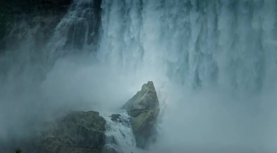 Explore the powerful waterfall cascading with mist in Toronto, Canada, a natural wonder captured in serene detail.