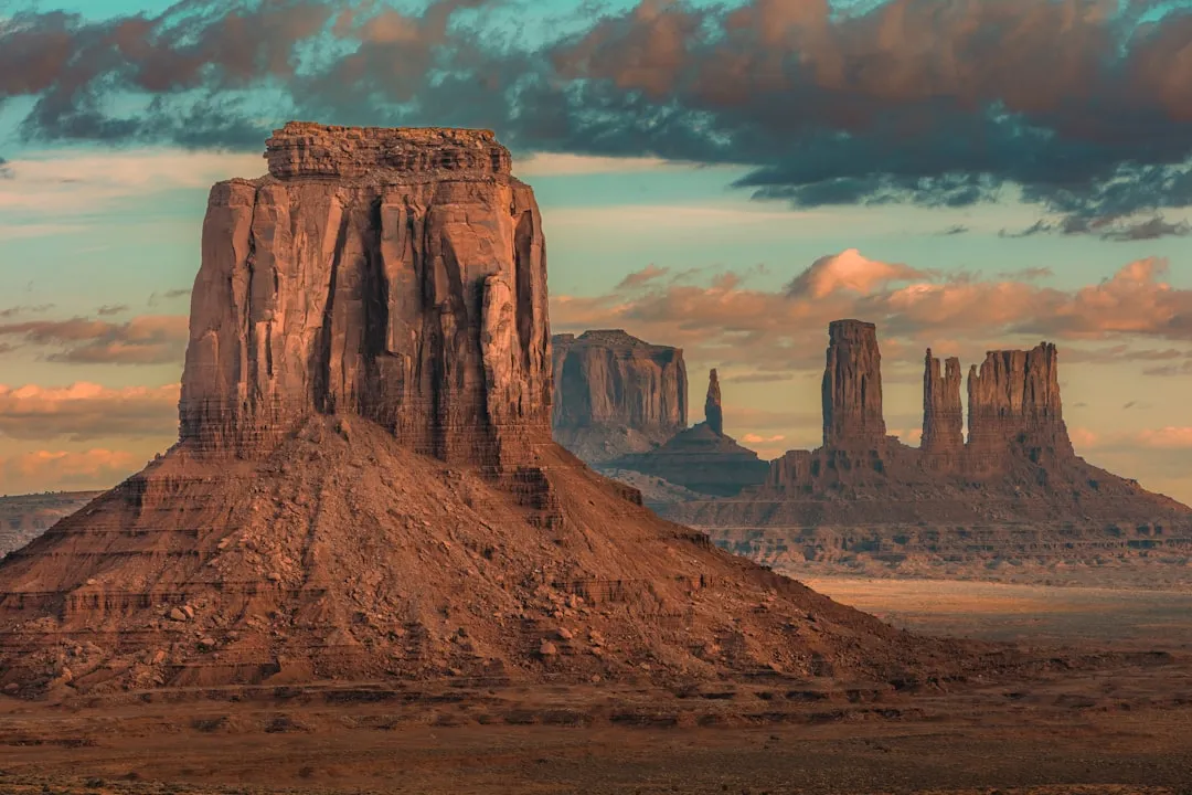 a large rock formation in the middle of a desert